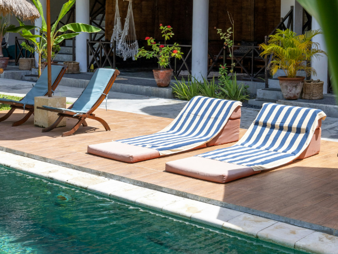 Loungers beside a hotel pool